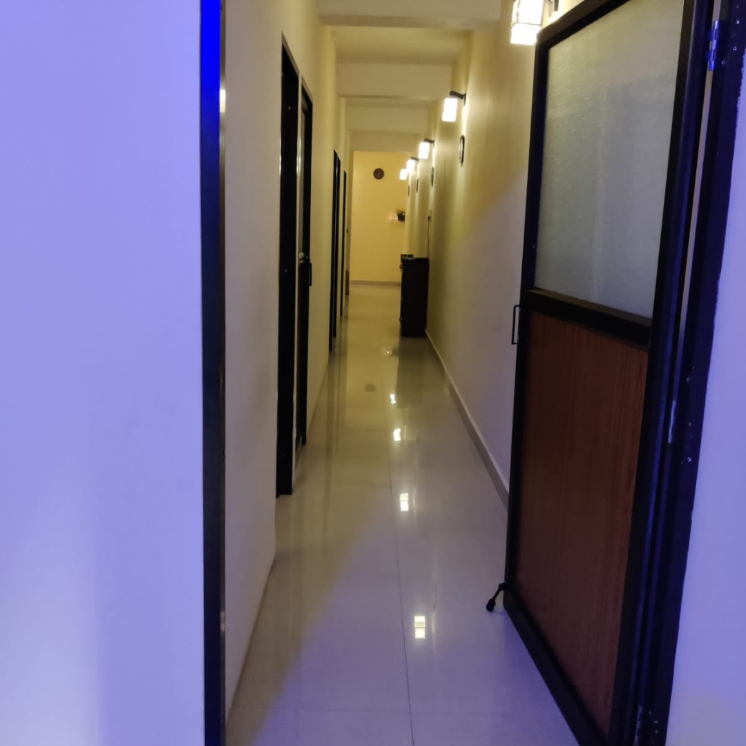 Spa therapy room with bed and candles